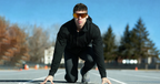 Runner at the starting line wearing BleeqUp Ranger AI sports camera glasses