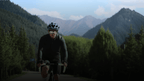 Cyclist riding through mountain roads for BleeqUp Rover 120-degree POV storytelling